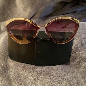 NWOT Authentic Prada sunglasses. These are rare glasses and brand new. No marks